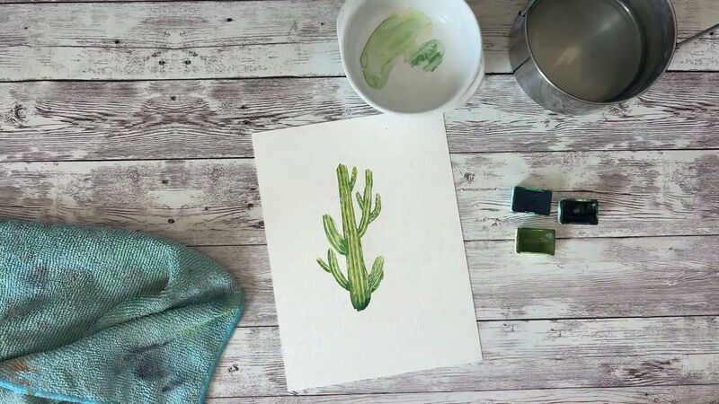 Aquarelle d'un cactus vert à bras, strié de lignes vert foncé et piqué de petits points blancs.